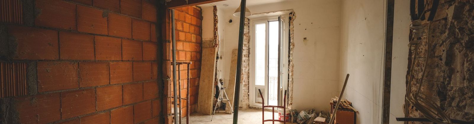 A house mid renovation with framing and bare drywall exposed