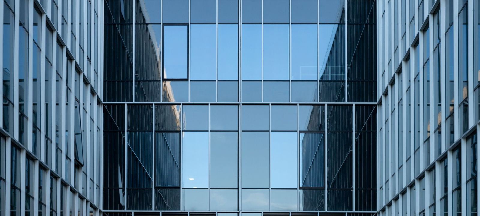 Glass and steel commercial office buildings seen from street level